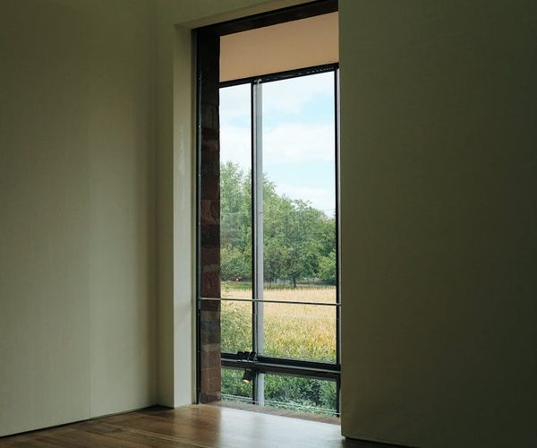 A serene and minimalist yoga studio space with natural light.
