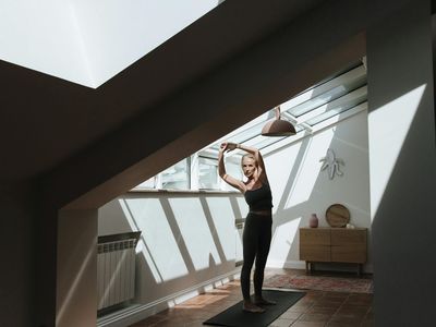 An empty, peaceful yoga mat waiting in a sunlit room.
