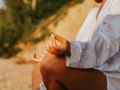 Close-up of hands in a mindful yoga mudra.